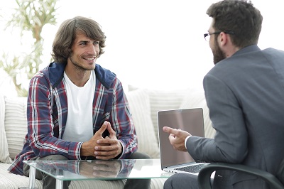 young man sitting on consultation with his lawyer. photo with copy space